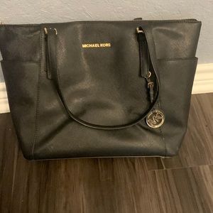 Michael Kors black purse. In good condition